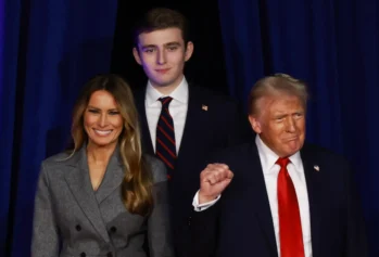 WEST PALM BEACH, FLORIDA - NOVEMBER 06: Republican presidential nominee, former U.S. President Donald Trump arrives to speak with former first lady Melania Trump and Barron Trump during an election night event at the Palm Beach Convention Center on November 06, 2024 in West Palm Beach, Florida. Americans cast their ballots today in the presidential race between Republican nominee former President Donald Trump and Vice President Kamala Harris, as well as multiple state elections that will determine the balance of power in Congress. (Photo by Joe Raedle/Getty Images)