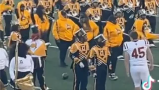 White Tuskegee Football Player Shoves Black Alabama State Band Member and Flips Crowd Off in Viral Video