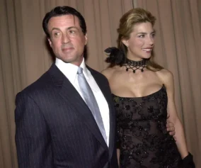 US actor Sylvester Stallone (L) and his wife Jennifer Flavin (R) arrive at "A Family Celebration 2001" gala fund-raising event in Beverly Hills, CA, 01 April 2001. AFP PHOTO/Lucy Nicholson (Photo by LUCY NICHOLSON / AFP) (Photo by LUCY NICHOLSON/AFP via Getty Images)