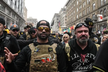 Enrique Tarrio, leader of the Proud Boys (L) and Joe Biggs (R) gather outside of Harry's bar during a protest on December 12, 2020 in Washington, DC. Thousands of protesters who refuse to accept that President-elect Joe Biden won the election are rallying ahead of the electoral college vote to make Trump's 306-to-232 loss official. (Photo by Stephanie Keith/Getty Images)