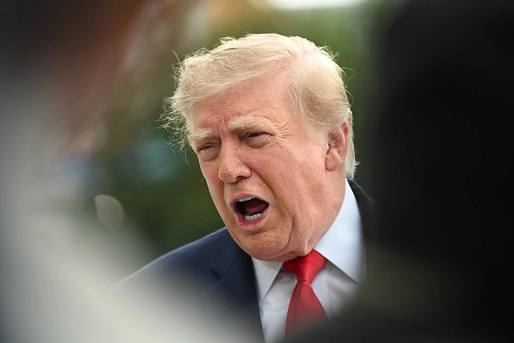 US President Donald Trump speaks to members of the press before boarding Marine One as he departs from the South Lawn of the White House in Washington, DC, on September 26, 2026. US President Donald Trump is heading to Knoxville, Tennessee to attend the Tennessee/Texas college football game. (Photo by Alex WROBLEWSKI / AFP via Getty Images)