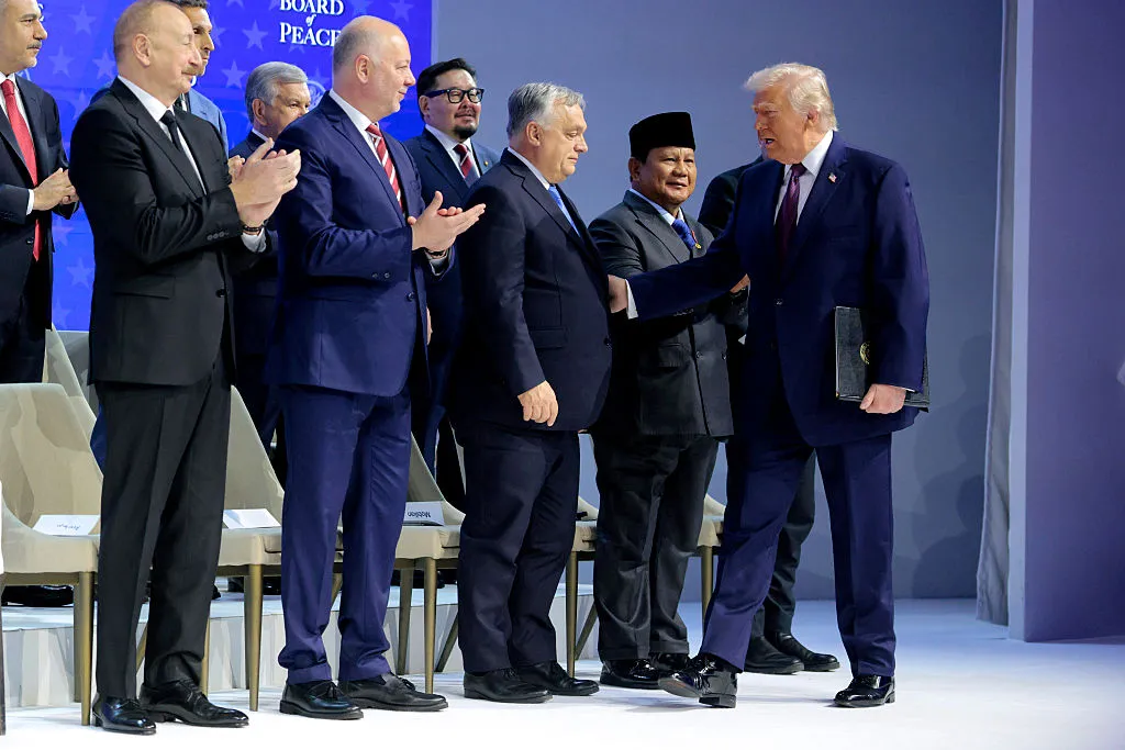 ‘What Are Those!?’: Trump Attempts a Dominance Handshake at Davos— but Gets Instantly Upstaged When Cameras Zoom In on the Shoes No One Can Ignore