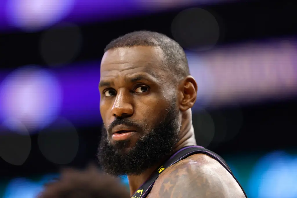 NBA All-Star Lebron James reunites with a woman in Oregon that he bumped into during a game in 2019. (Photo by Ronald Martinez/Getty Images)