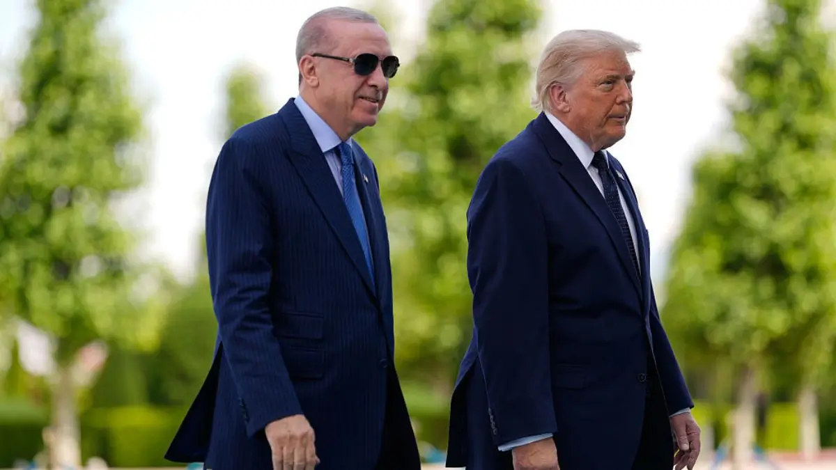 President Donald Trump poses with Turkish President Recep Tayyip Erdoğan ahead of the NATO summit.