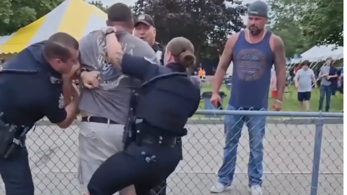 White Man Grabs Cop’s Holster, Nearly Knocks Over Another and Remains Unscathed, Sparking Debate Over Racial Double Standard In Policing